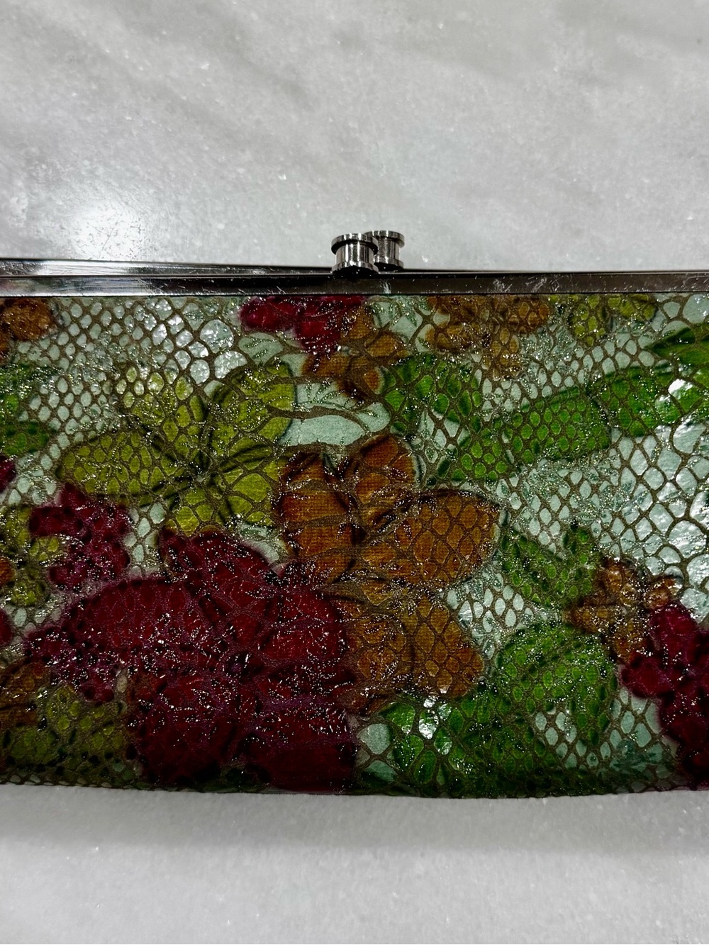 HOBO Floral Lace-Overlay Clutch in Green, Red, and Brown